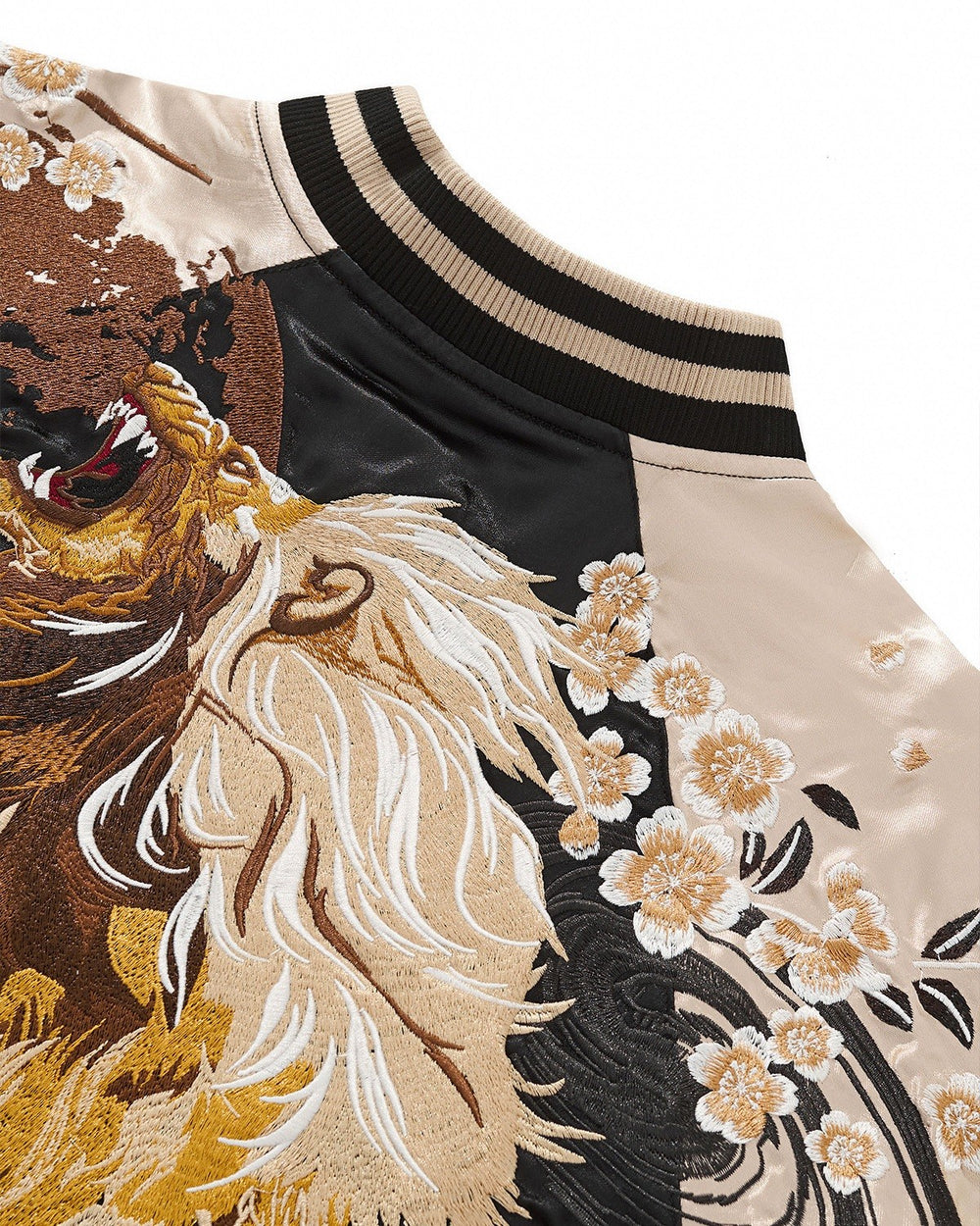 Close-up of the striped rib collar beside the lion's mane and blossoms