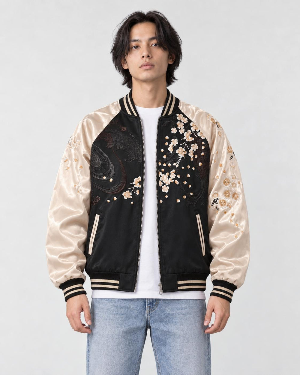 Model wearing the black and cream lion sukajan half zipped, front view