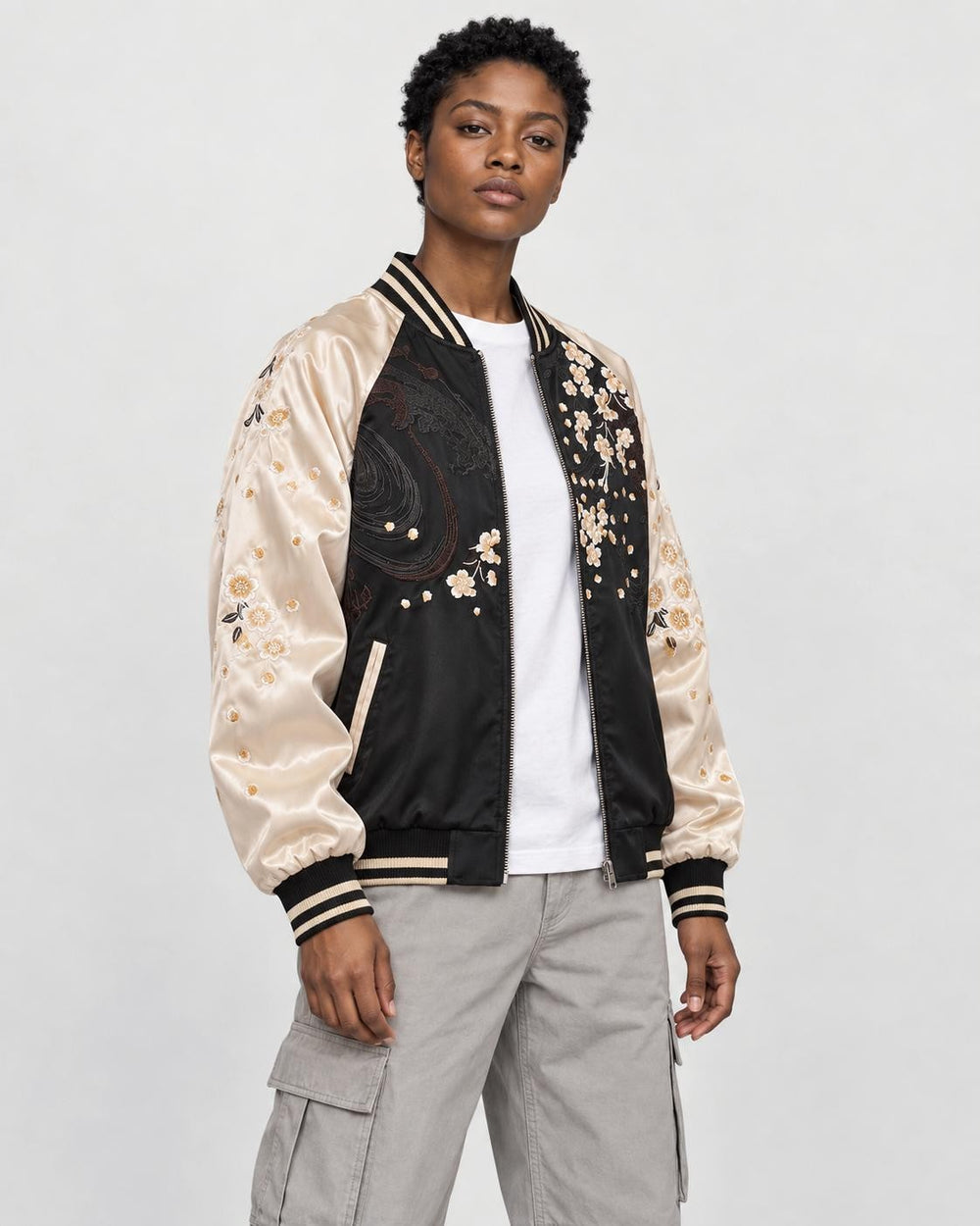 Model wearing the lion sukajan open, three-quarter view