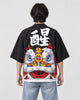 Model seen from behind in the black lion dance haori cardigan with a white calligraphy character and a lion head