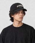 Model wearing the black Los Angeles dad cap, three-quarter view