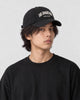 Model wearing the black Los Angeles dad cap, three-quarter view