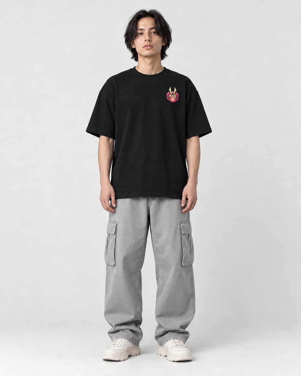Model wearing the black daruma T-shirt with jeans, front view