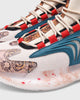 Close-up of the knit upper, laces and marble print on the beige sneaker