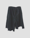 Black asymmetric panelled knee-length shorts, back view