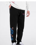 Black jogger pants with ribbed cuffs and a blue wave and koi embroidery on the lower leg, front view