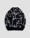 Back of the black cat face knit sweater, with the crowd of white line-drawn cats