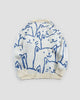 Back of the cream cat face knit sweater, with the crowd of blue line-drawn cats