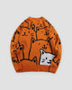 Orange knit sweater covered in black line-drawn cat faces with one white cat at the lower right, front view