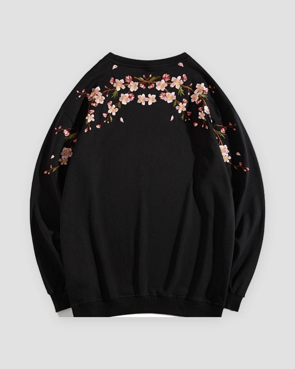Black crew-neck sweatshirt laid flat, back with blossom branches across the shoulders