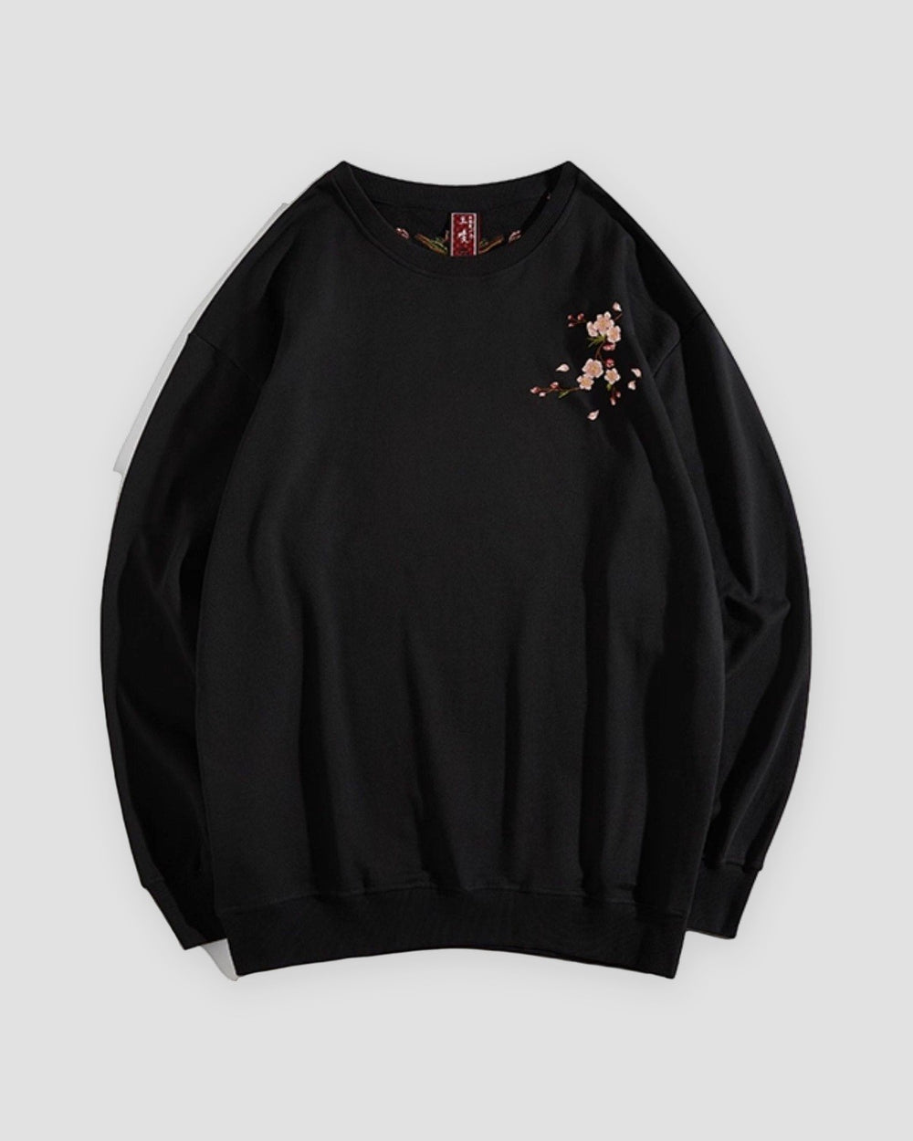 Black crew-neck sweatshirt with a small embroidered blossom sprig on the chest, front view