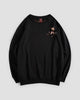 Black crew-neck sweatshirt with a small embroidered blossom sprig on the chest, front view