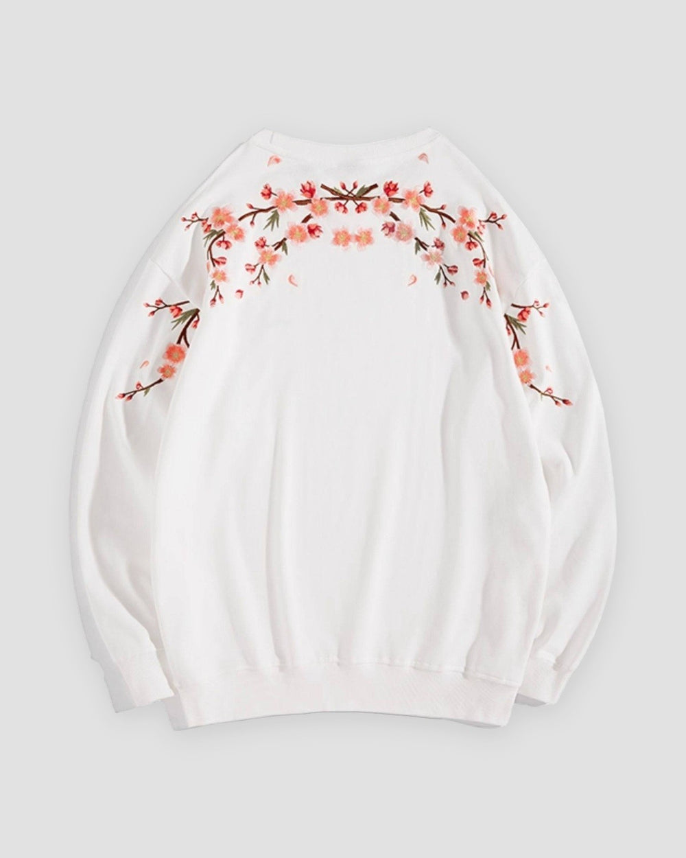 White crew-neck sweatshirt laid flat, back with blossom branches across the shoulders
