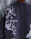 Close-up of the pale coiling dragon on the black haori