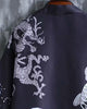 Close-up of the pale coiling dragon on the black haori