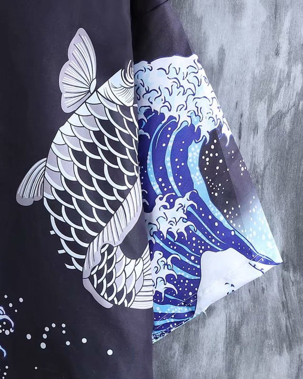 Close-up of the gray scaled carp leaping beside the wave on the haori