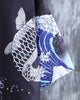 Close-up of the gray scaled carp leaping beside the wave on the haori