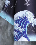 Close-up of the blue and white Great Wave print fading to pale blue foam at the haori sleeve