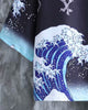 Close-up of the blue and white Great Wave print fading to pale blue foam at the haori sleeve