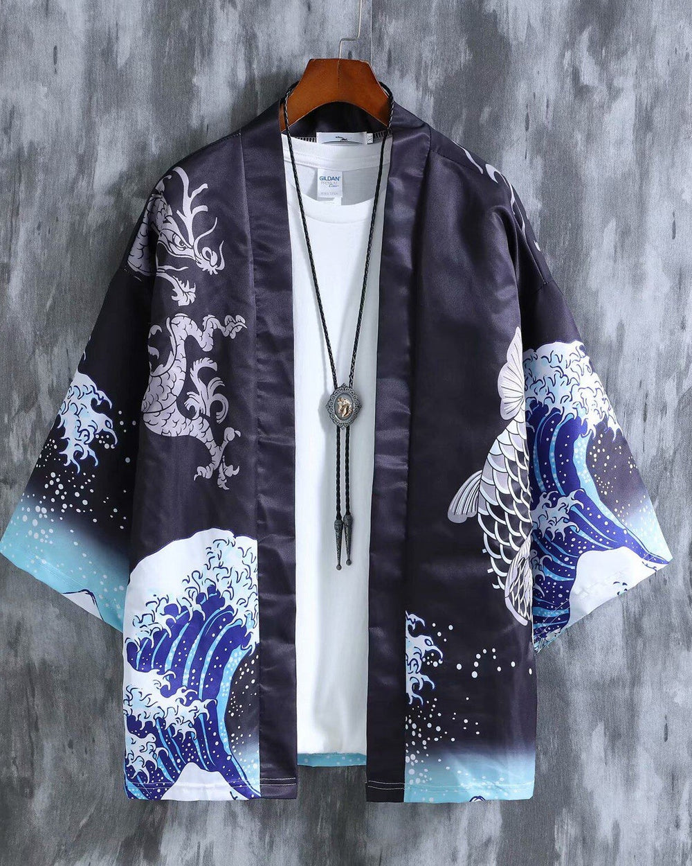 Black haori hanging open over a white tee, with the wave print on both sleeves
