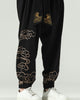 Close-up of the gold cloud embroidery down the lower leg and above the elastic cuff