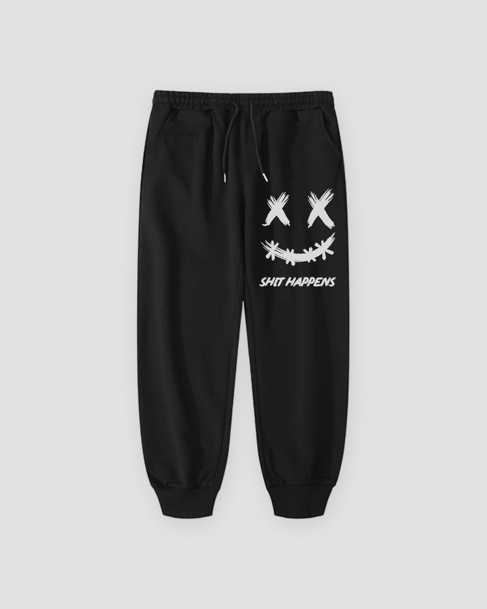 Black cotton jogger pants with a white crossed-out-eyes smiley print on the thigh, laid flat