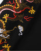 Close view of the dragon embroidered down the sleeve in gold, pink, red and white thread with white clouds on black cotton