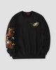 Black crew-neck sweatshirt with a gold, red and white dragon embroidered down one sleeve and a small dragon head on the chest