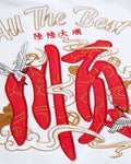 Close-up of the red character, white crane and gold-thread script embroidered on the back of the white T-shirt