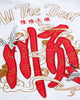 Close-up of the red character, white crane and gold-thread script embroidered on the back of the white T-shirt