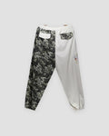 Back of the cream and wave-print jogger pants, with a flap pocket on each leg cut from the other leg's cloth