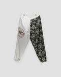 Cream and wave-print jogger pants with an embroidered dragon on the cream leg, front view
