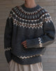 Charcoal gray fair-isle sweater with a cream and brown zigzag yoke, torso view