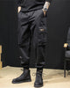 Black cargo joggers with a flap pocket and woven label, worn with black boots