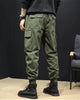 Close-up of the large flap pocket on the thigh of the army green cargo joggers