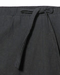 Close-up of the elastic waist and the flat drawcord on the black harem pants