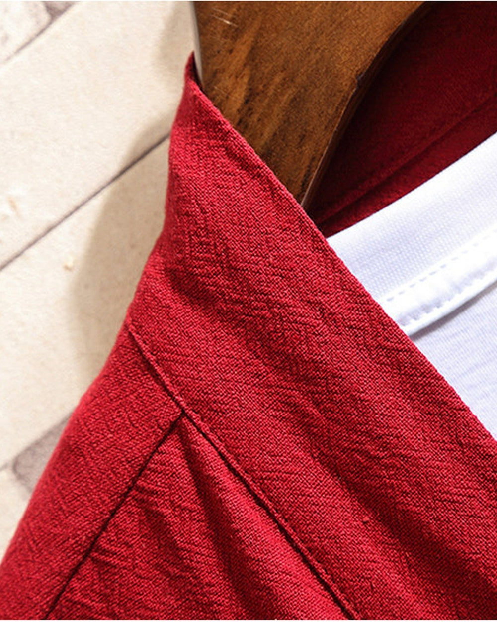 Close-up of the shawl collar band and the crinkled linen weave on the red haori cardigan