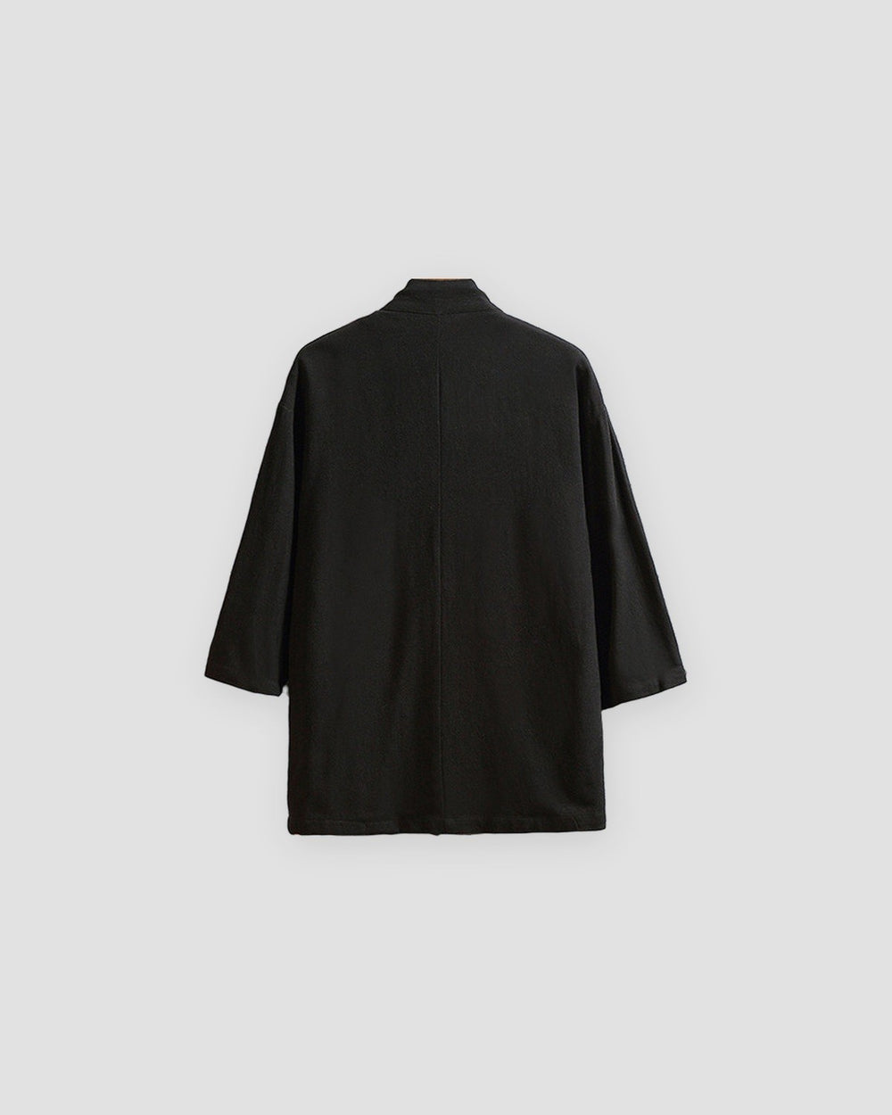 Back of the black linen haori cardigan with a small stand collar and a centre seam
