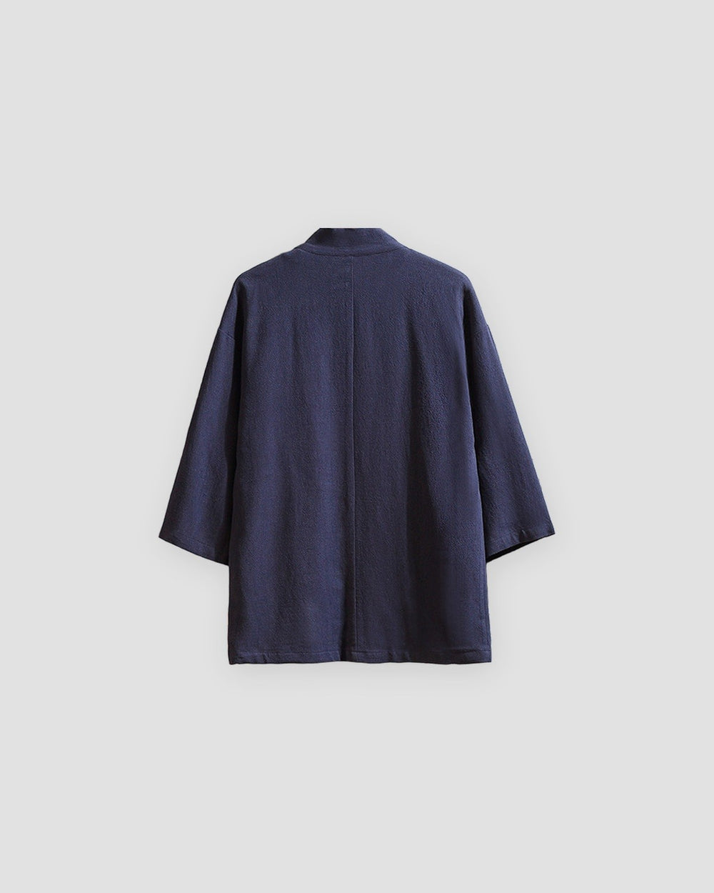 Back of the navy linen haori cardigan with a small stand collar and a centre seam