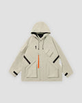 Beige hooded jacket with an orange zip pull, black chest straps, flap pockets and a small black logo, laid flat