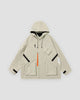 Beige hooded jacket with an orange zip pull, black chest straps, flap pockets and a small black logo, laid flat