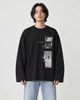 Model wearing the black loose long sleeve tee with a photo print on the chest, light-wash jeans and white sneakers