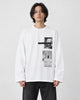Model wearing the white loose long sleeve tee with a photo print on the chest, black jeans and white sneakers