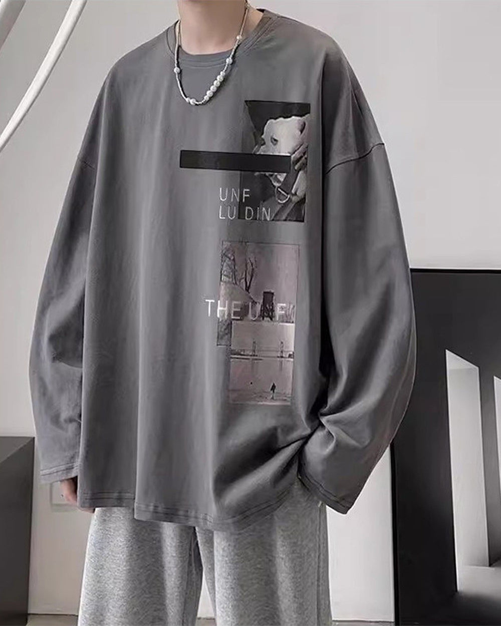 Charcoal loose long sleeve tee with a black bar and two photo panels on the chest, worn with gray sweatpants