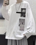 White loose long sleeve tee with a black bar and two photo panels on the chest, worn with a chain necklace