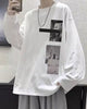 White loose long sleeve tee with a black bar and two photo panels on the chest, worn with a chain necklace