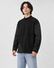 Man in the black mock-neck sweatshirt turned slightly, showing the sleeve panels and stitching