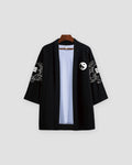Front of the open black haori with a small yin-yang on the left panel and cloud art on the sleeves