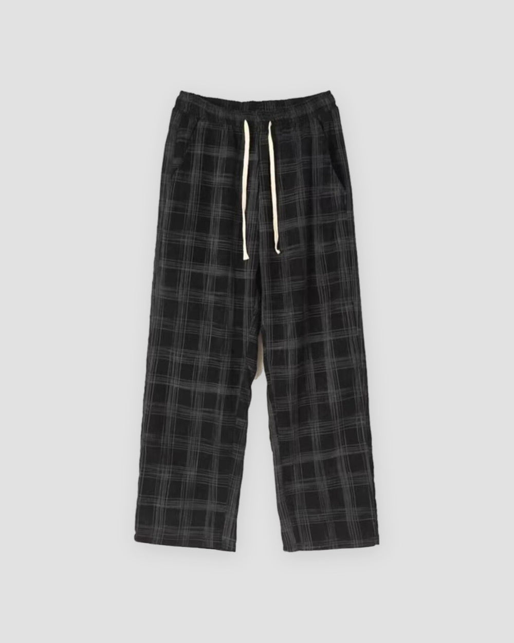 Black plaid wide-leg drawstring pants laid flat, front view
