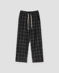 Black plaid wide-leg drawstring pants laid flat, front view